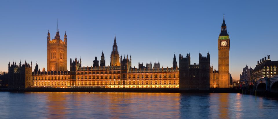 The Palace of Westminster at dusk, seen across the Thames